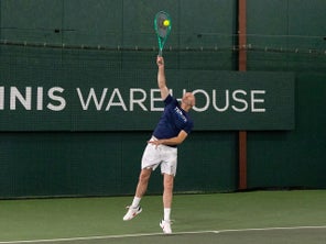 Image of a Playtester Hitting Serve