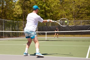 Image of Playtester hitting a return of serve