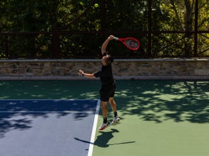 TW playtester hitting a serve. 