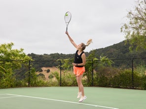 Image of Playtester hitting a serve