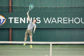 Image of a Playtester hitting a Serve