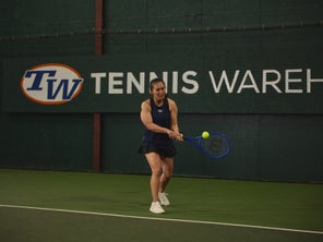Image of a TW playtester hitting a backhand. 
