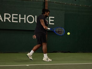Image of a TW playtester hitting a return. 