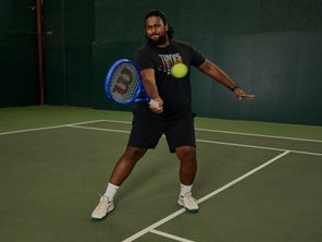 Image of a TW playtester hitting a volley. 