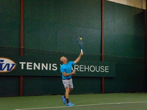 Image of a Playtester Hitting a Serve