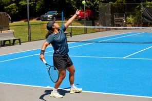 Image of a Playtester Hitting a Serve