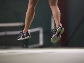Image of Closeup of Shoes on Feet During Serve