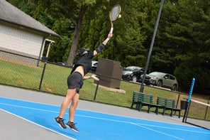 Image of a Playtester Hitting a Serve