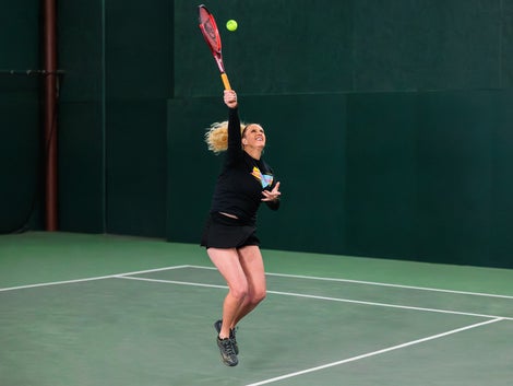 Michelle goes up for an overhead with the Mizuno Wave Exceed Tour 6. 