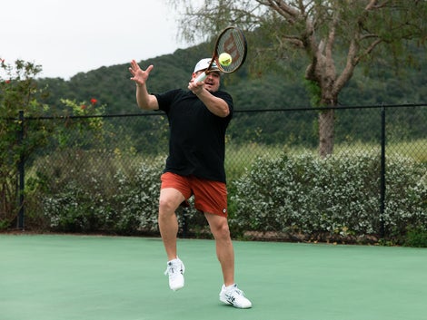 Troy lines up a forehand. 