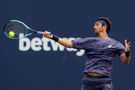 Lorenzo Musetti hitting a forehand. 