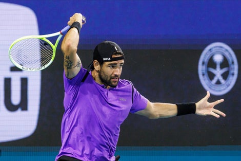 Matteo Berrettini following through a forehand 