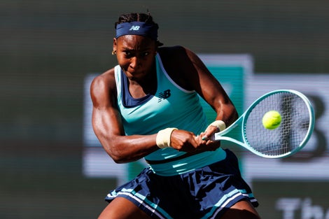 Image of Coco Gauff hitting a backhand. 