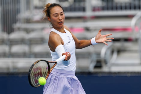 Image of Qinwen Zheng hitting a forehand. 