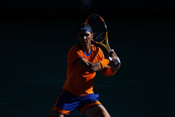 Nadal follows through on a backhand. 