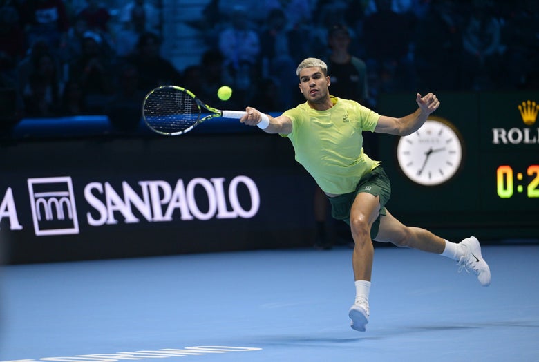 Alcaraz reaches for a forehand. 