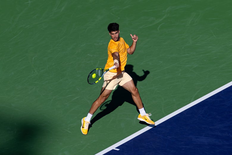Image of Carlos Alcaraz smacking a forehand. 