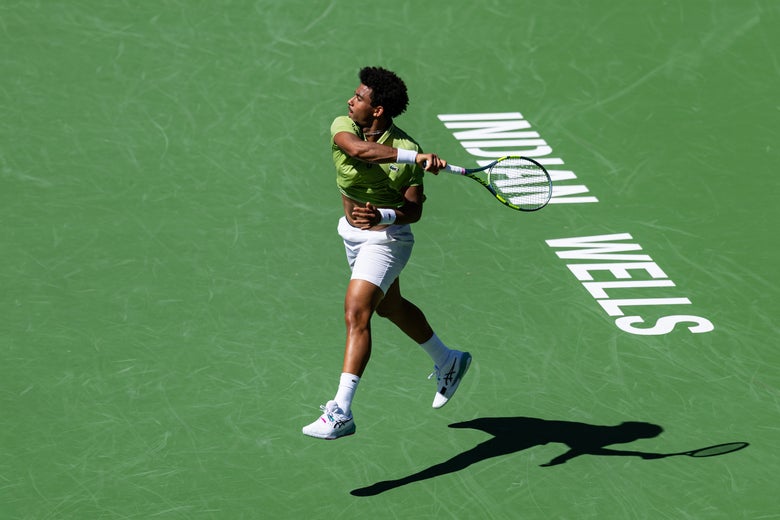 Image of Arthur Fils ripping a forehand. 