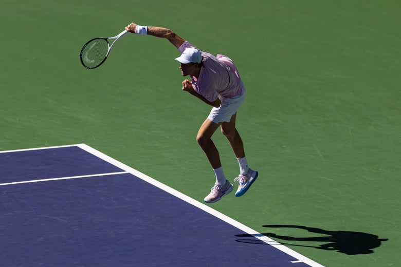 Image of Jannik Sinner crushing a serve. 
