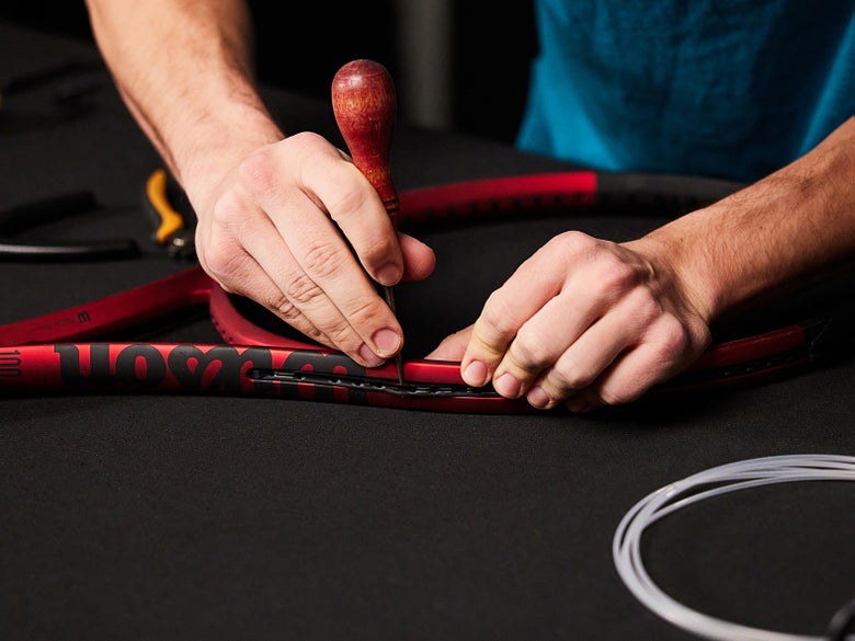 Image of Using an Awl to Remove Grommet Strips