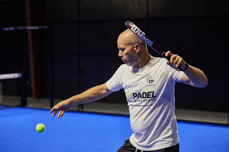 Teardrop racket in-hand. 