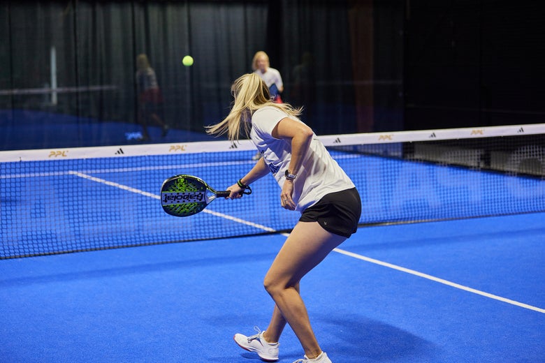 Image of a Padel Warehouse playtester hitting a soft shot to the middle. 