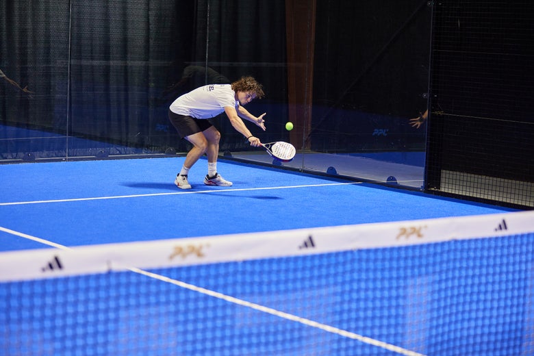 Image of a Padel Warehouse playtester hitting a lob. 