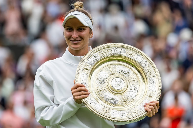 Image of Marketa Vondrousova with the Wimbledon Trophy