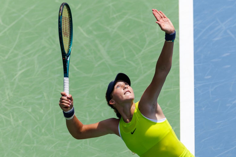 Mirra Andreeva serving. 