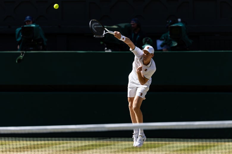 Jannik Sinner laces a serve. 