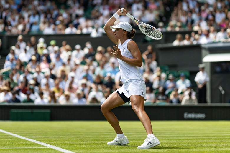 Swiatek whips through a forehand. 