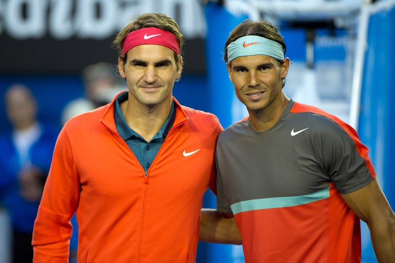 Nadal and Federer pose at net before their 2014 Australian Open semi-finals match. 