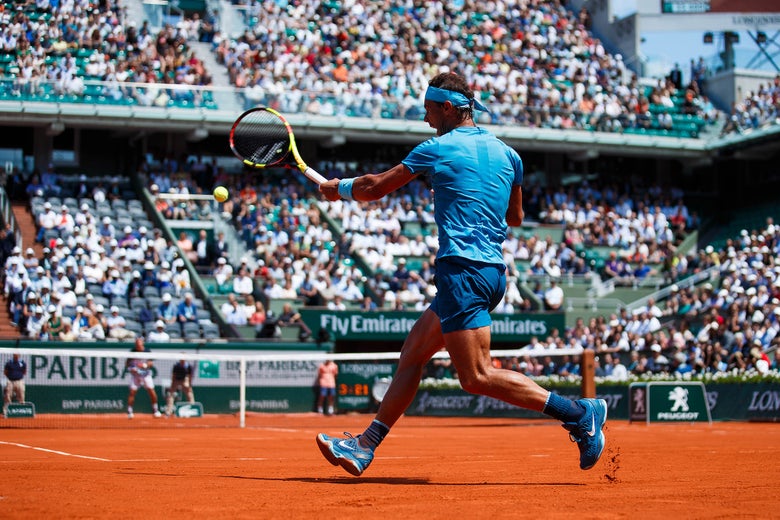 Rafa rips a giant forehand during the 2018 French Open.
