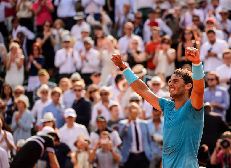 Rafa celebrates victory in a packed stadium. 