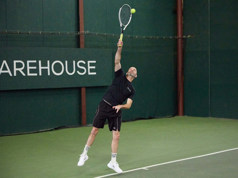 Playtester hitting a serve