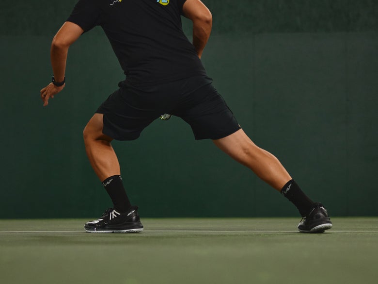 Playtester on the court wearing Baseline Bully shoes