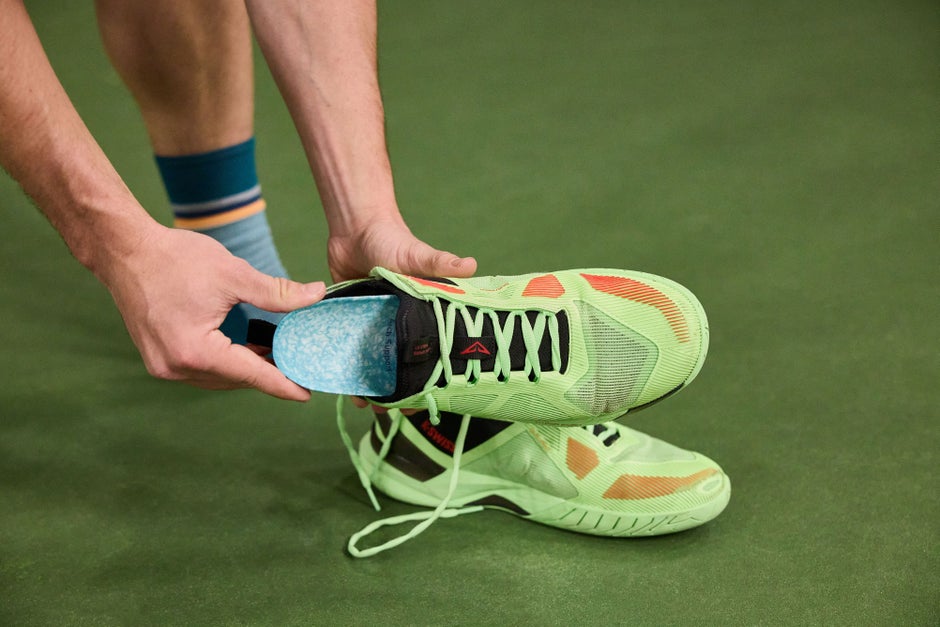 Blumaka insole being further inserted into a shoe.