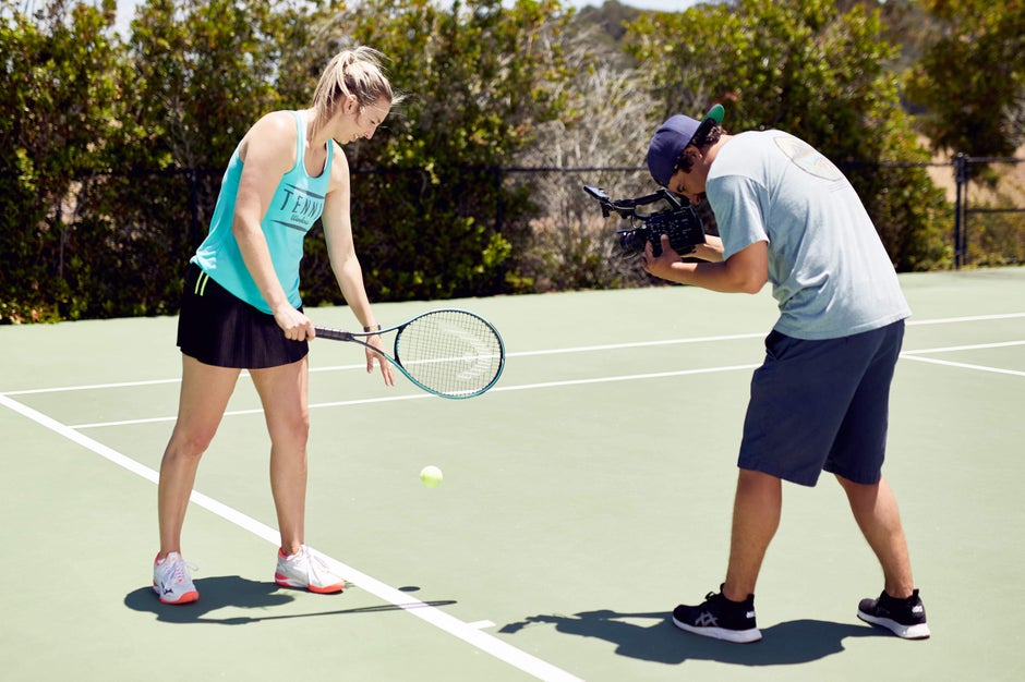 Behind the scenes look of a review being filmed on the tennis court