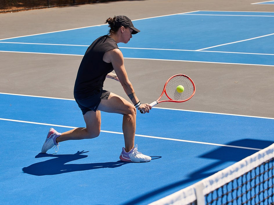Playtester hitting a backhand volley