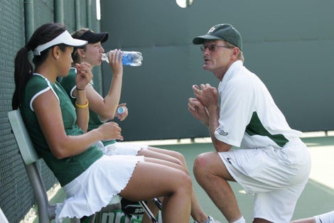 Teaching Pro coaching tennis players