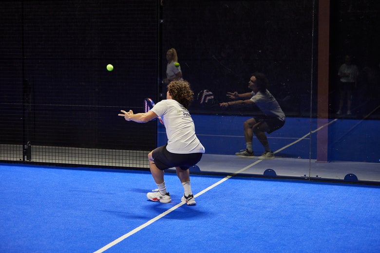 Image of a Padel Warehouse playtester defending off the wall.
