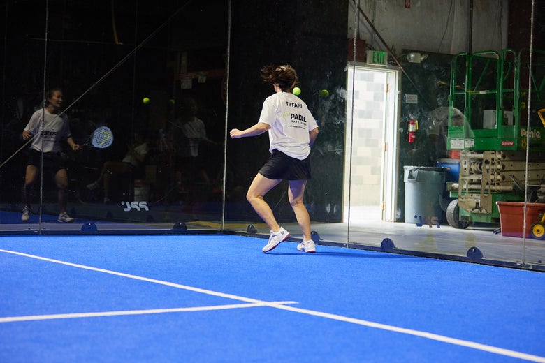 Image of a Padel Warehouse playtester returning a serve.