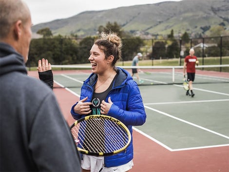 Tennis players getting ready to play tennis