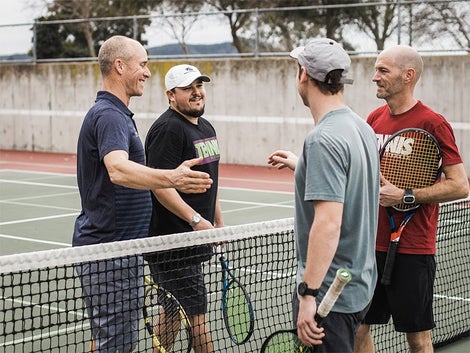 Doubles Team shaking hands at net