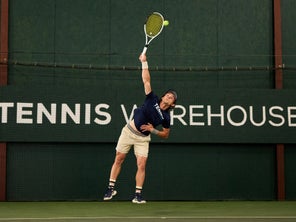 Image of a Playtester Hitting a Serve