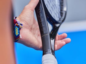 Image of a TW playtester getting the racquet set.