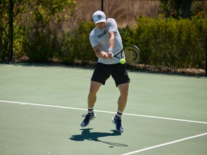 Image of a TW playtester hitting a backhand.
