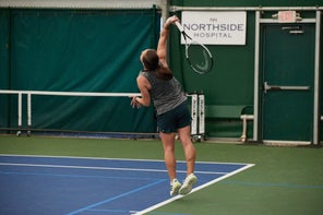 Image of a Playtester Hitting a Serve