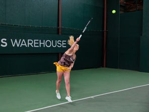 Image of a Playtester Hitting a Serve