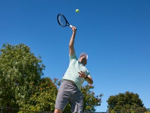 Image of a Playtester Hitting a Serve